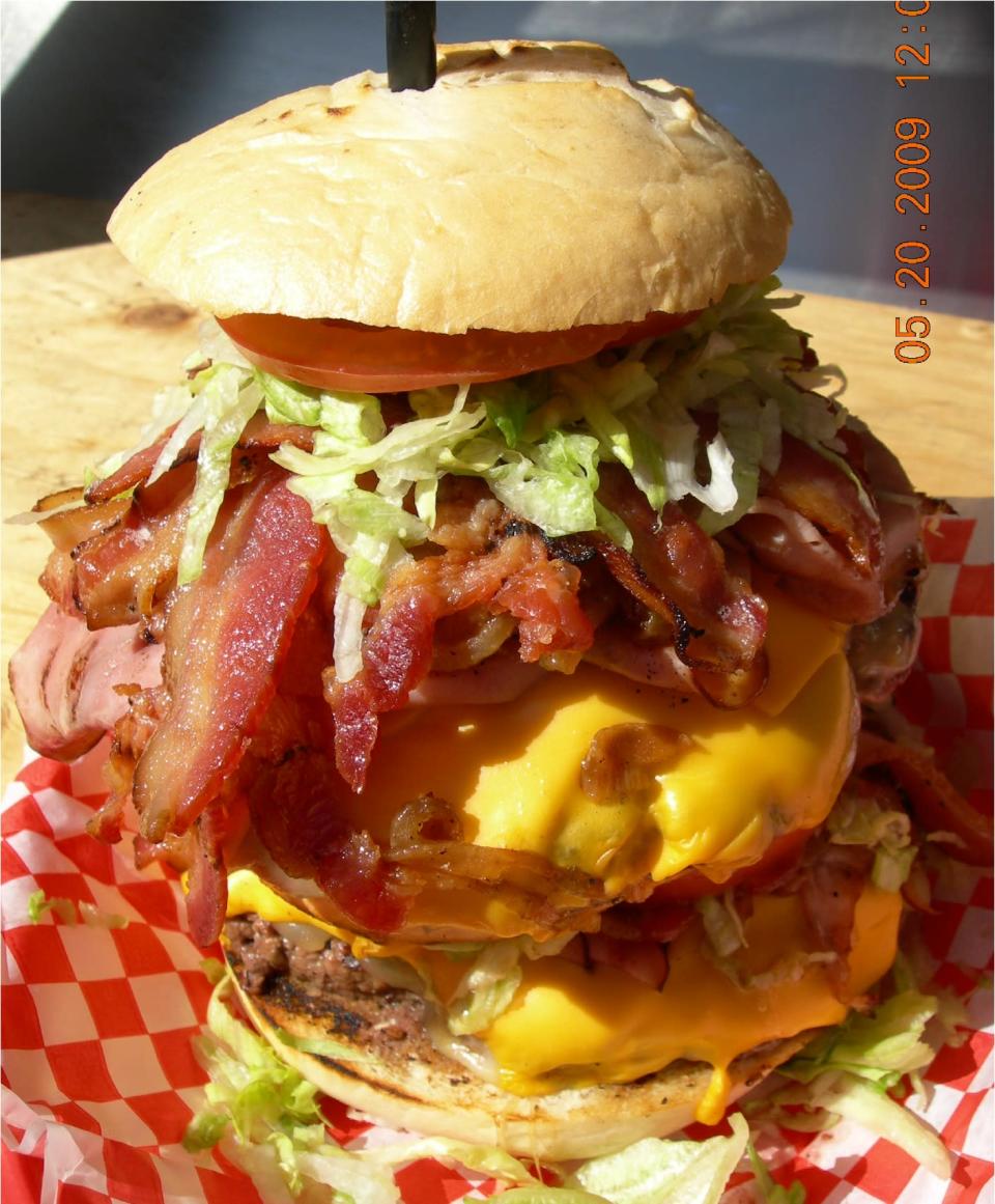 <b>Alaska: The Seward Folly</b> This two-pound caribou burger from the West Rib Pub and Grill has twelve slices of bacon.<br> <br> (Image courtesy Dennis Freeman)