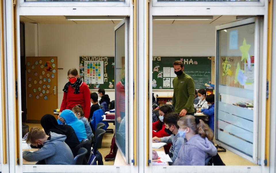 Classroom window of Freiherr-vom-Stein secondary school in the North Rhine-Westphalian city of Bonn stays open for venting -  WOLFGANG RATTAY/REUTERS