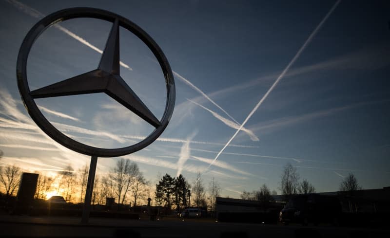 The sun rises behind a Mercedes star on the Mercedes-Benz plant. The German automaker sold 6% fewer vehicles in the first quarter of the year than in the same period last year, the company reported on 10 April. Sebastian Gollnow/dpa