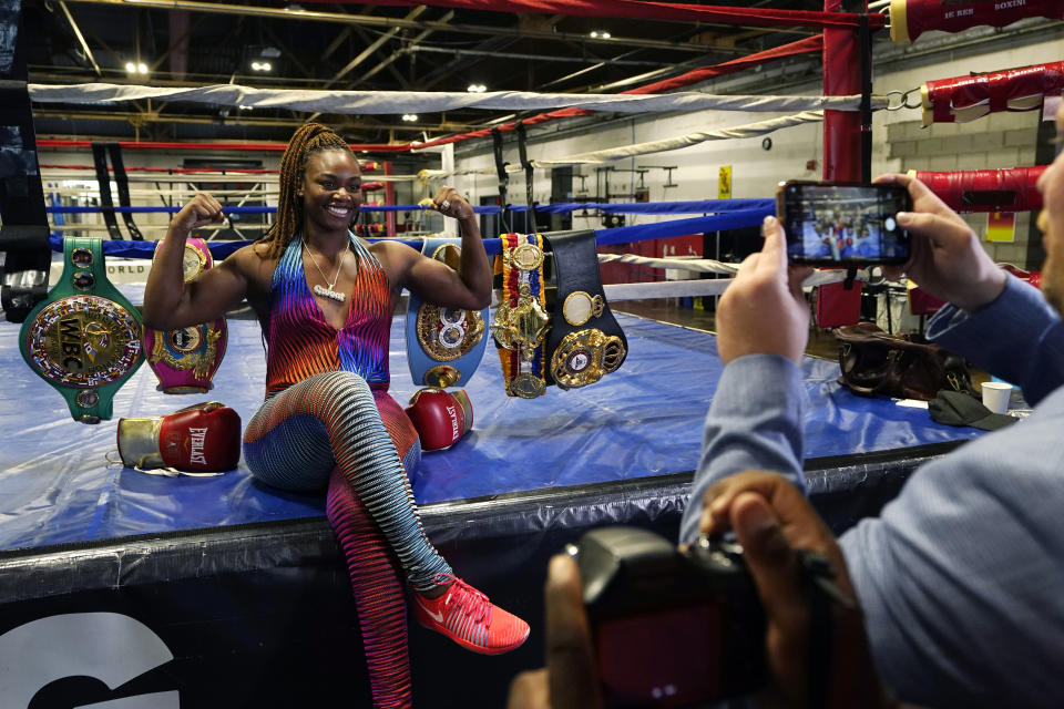 FILE - Claressa Shields, left, poses for promoter Dmitry Salita at the Downtown Boxing Gym, July 27, 2022, in Detroit. Shields is scheduled to fight Hanna Gabriels for the women’s world middleweight championship on June 3, 2023, bringing boxing to Little Caesars Arena for the first time since it opened in 2017. (AP Photo/Carlos Osorio, File)