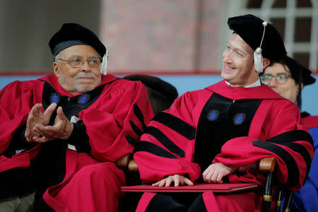 Actor James Earl Jones (L) applauds after Facebook founder Mark Zuckerberg received an honorary Doctor of Laws degree during the 366th Commencement Exercises at Harvard University in Cambridge, Massachusetts, U.S., May 25, 2017. REUTERS/Brian Snyder