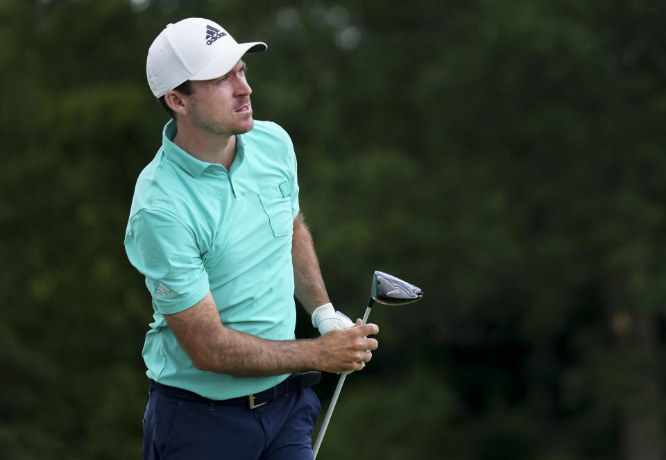 Canada's Nick Taylor watches his tee shot on the 18th hole during round three of the Canadian Open golf tournament at St. George's Golf and Country Club in Toronto, Saturday, June 11, 2022. (Nathan Denette/The Canadian Press via AP)