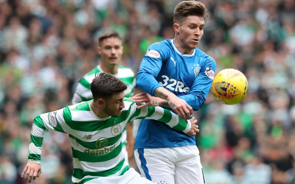 Celtic's Patrick Roberts was on song early in the match. Here he is battling Rangers' Josh Windass - PA