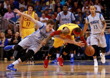 Dec 11, 2015; Orlando, FL, USA; Orlando Magic guard Mario Hezonja (23) defends Cleveland Cavaliers guard Mo Williams (52) during the second half at Amway Center. The Cavaliers won 111-76. Mandatory Credit: Kim Klement-USA TODAY Sports