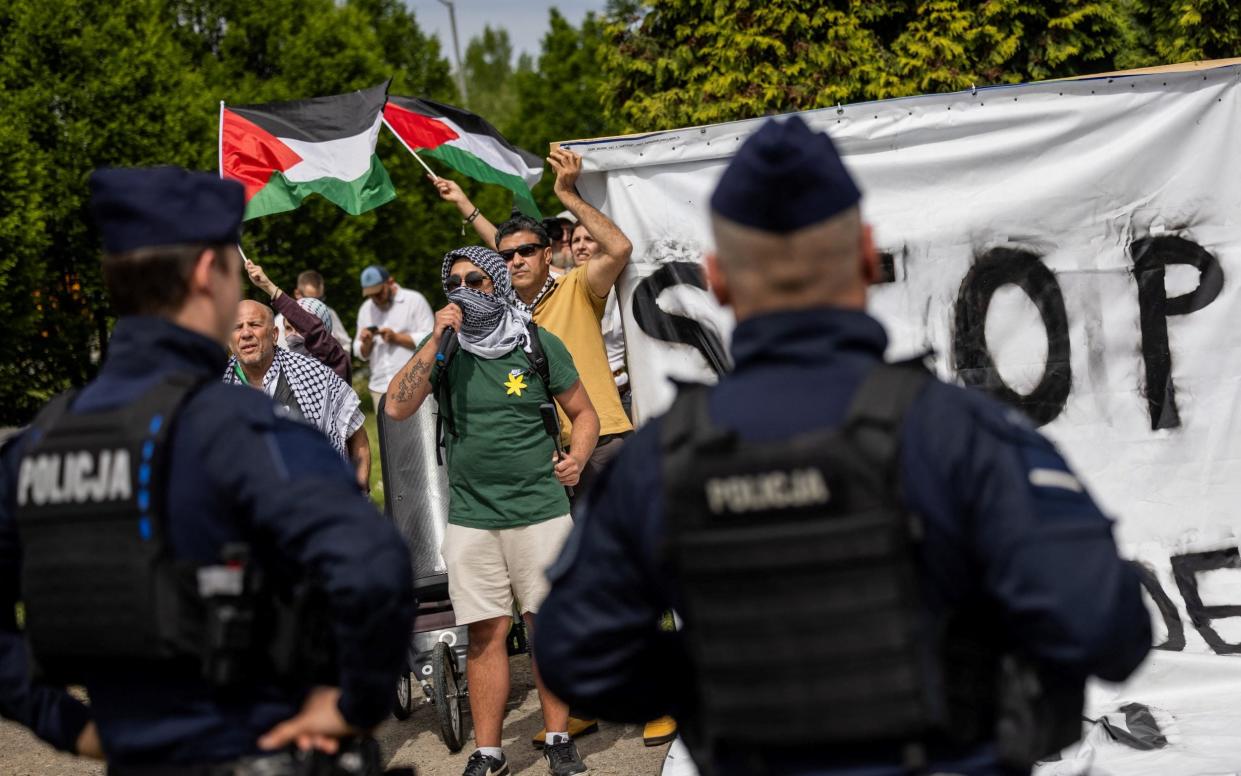 Protesters chanted slogans at those attending the solemn march from Auschwitz