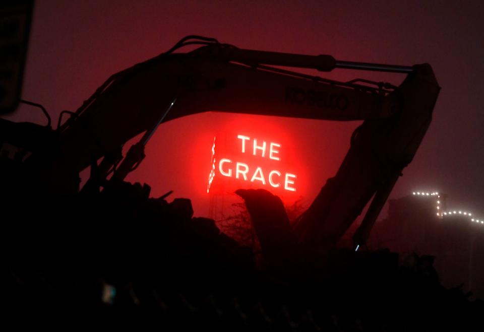 The Grace Museum is framed in the fog by the arm on an excavator at rest on the site of the former Abilene Reporter-News building early morning Dec. 10.