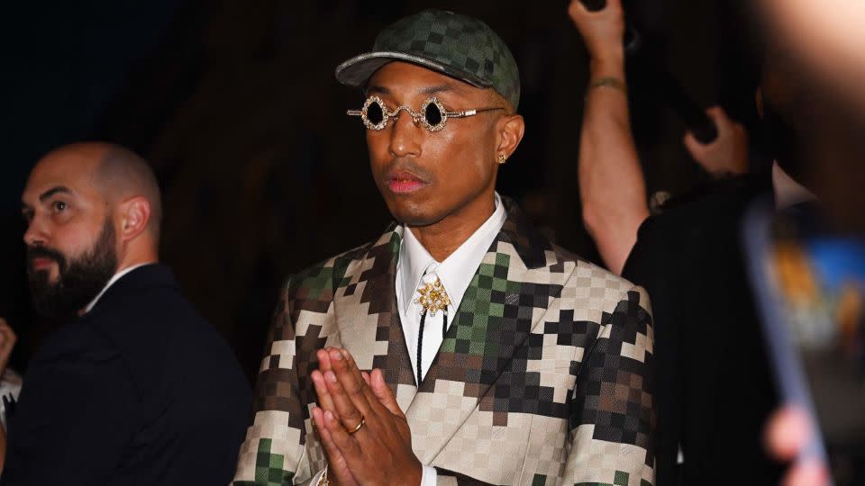 Pharrell Williams acknowledges the audience at the end of his Louis Vuitton Menswear Spring-Summer 2024 show. - Stefano Rellandini/AFP/Getty Images