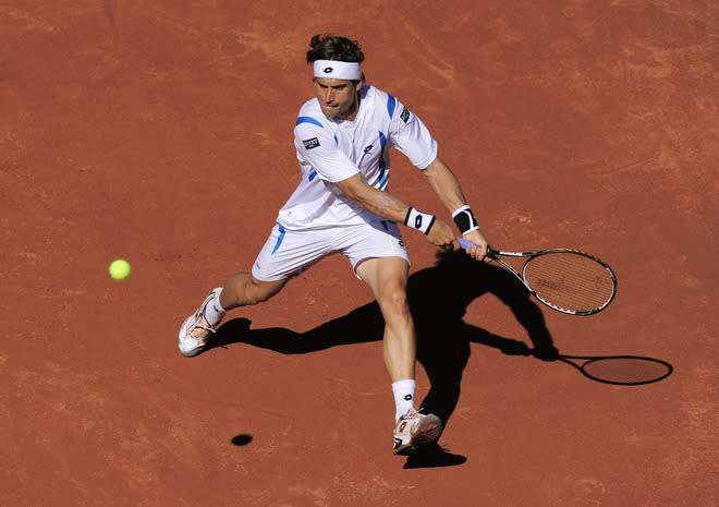 Spanish David Ferrer returns the ball to his compatriot Rafael Nadal during the final of the Barcelona Open tennis tournament Conde de Godo on April 29, 2012 in Barcelona. Nadal won 7-6, 7-5. AFP PHOTO / JOSEP LAGOJOSEP LAGO/AFP/GettyImages