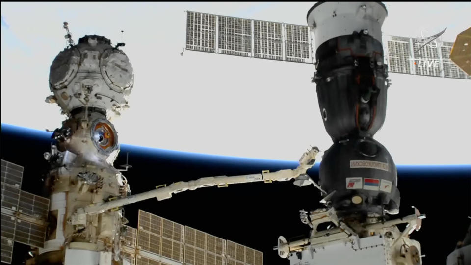 Cosmonaut Anna Kikina, working inside the Russian Nauka lab module (left), uses a European-built robot arm to inspect the Soyuz MS-22 spacecraft (right) after it sprang an apparent coolant leak, forcing Russian flight controllers to cancel an already planned spacewalk. Dec. 14, 2022. / Credit: NASA TV