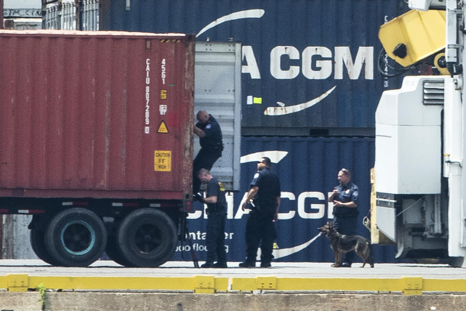 Authorities search a container along the Delaware River in Philadelphia, Tuesday, June 18, 2019. U.S. authorities have seized more than $1 billion worth of cocaine from a ship at a Philadelphia port, calling it one of the largest drug busts in American history. The U.S. attorney’s office in Philadelphia announced the massive bust on Twitter on Tuesday afternoon. Officials said agents seized about 16.5 tons (15 metric tons) of cocaine from a large ship at the Packer Marine Terminal. (AP Photo/Matt Rourke)