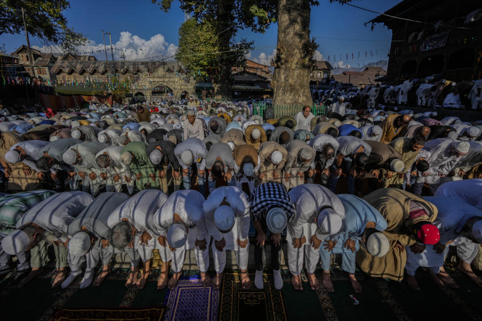 FILE - Kashmiri Muslims offer special prayers locally known as "Khawaja-e-Digar" outside the shrine of Naqashband Sahib during an annual festival in Srinagar, Indian controlled Kashmir, Wednesday, Sept. 20, 2023. The nones in India come from an array of belief backgrounds, including Hindu, Muslim and Sikh. The surge of Hindu nationalism has shrunk the space for the nones over the last decade, activists say. (AP Photo/Mukhtar Khan, File)