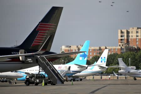 Republican presidential nominee Donald Trump's campaign plane (L) sits on the same tarmac as Democratic nominee Hillary Clinton's campaign plane (R), at Washington National airport in Washington, U.S., September 16, 2016. REUTERS/Carlos Barria