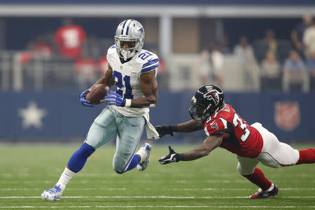 Sep 27, 2015; Arlington, TX, USA; Dallas Cowboys running back Joseph Randle (21) runs the ball against the Atlanta Falcons in the first quarter against the Atlanta Falcons at AT&T Stadium. Mandatory Credit: Tim Heitman-USA TODAY Sports / Reuters Picture Supplied by Action Images