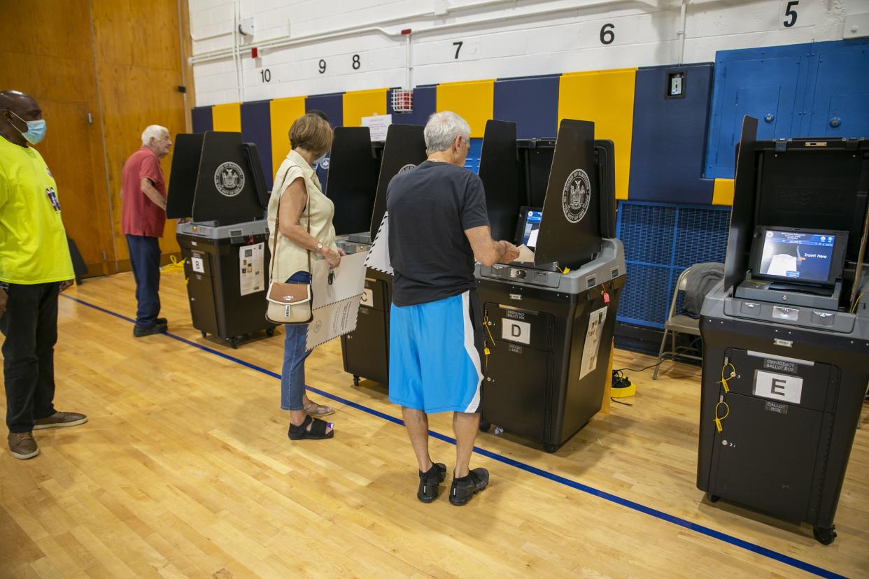 People vote at the Anning S. Prall Intermediate School in the Staten Island borough of New York City on Tuesday, June 28, 2022. 