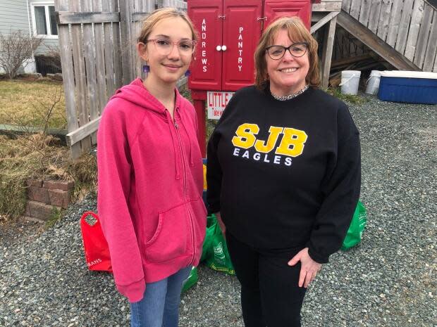 Principal Linda Hart, seen there with Grade 7 student Anna Breen-Cleary, said it's important to help out a community that constantly helps out their school. 