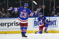 New York Rangers center Ryan Strome (16) and defenseman Adam Fox (23) celebrate Strome's goal during the second period of the team's NHL hockey game against the Chicago Blackhawks, Saturday, Dec. 4, 2021, at Madison Square Garden in New York. (AP Photo/Mary Altaffer)