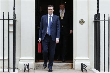 Britain's Chancellor of the Exchequer, George Osborne, carries his budget case as leaves number 11 Downing Street, before delivering his budget to the House of Commons, in central London March 19, 2014. REUTERS/Suzanne Plunkett