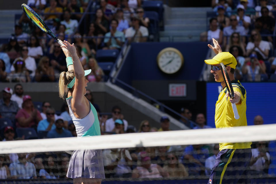 John Peers, right, of Australia, and Storm Sanders, of Australia, react after winning the mixed doubles final against Kirsten Flipkens, of Belgium, and Edouard Roger-Vasselin, of France, at the U.S. Open tennis championships, Saturday, Sept. 10, 2022, in New York. (AP Photo/Matt Rourke)