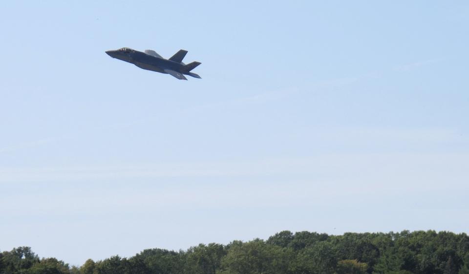 The first of two F-35 fighter jets makes a pass over the Vermont Air National Guard base, Thursday, Sept. 19, 2019, in South Burlington, Vt. The first two of what will become 20 F-35 fighter aircrafts arrived Thursday at The Vermont Air National Guard, the first guard unit to receive the next-generation fighter. (AP Photo/Wilson Ring)