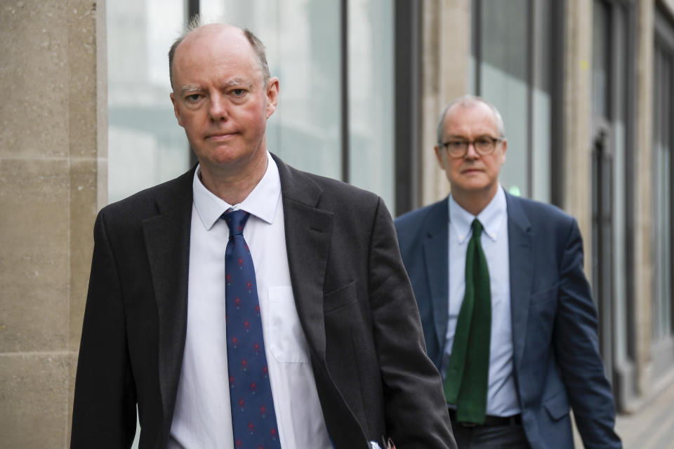 Chief Medical Officer Professor Chris Whitty, left and Chief Scientific Adviser Sir Patrick Vallance walk after the virtual press conference in which the Government announced that the legal limit on social gatherings is set to be reduced from 30 people to six. in London, Wednesday, Sept. 9, 2020. (AP Photo/Alberto Pezzali)