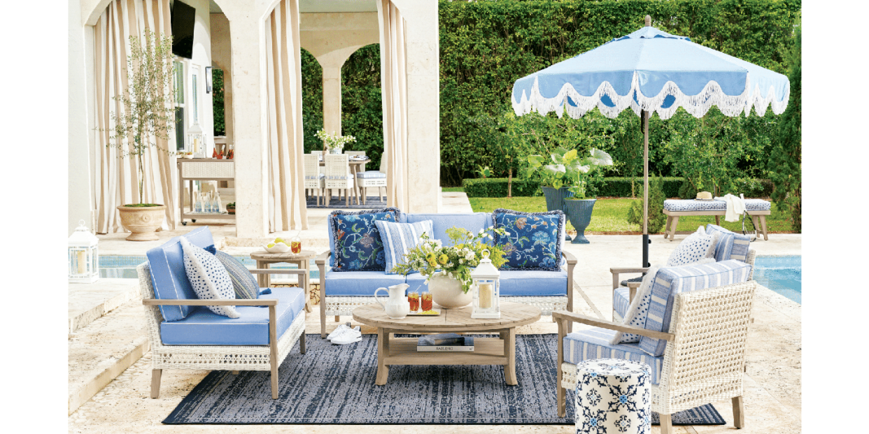 spring refresh collection frontgate outdoor couch, outdoor chair, drink stand, umbrella, outdoor cushions