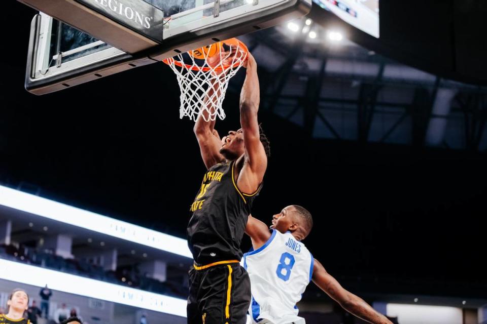 Quincy Ballard slam homes a dunk in the second half of Wichita State’s game against Memphis on Thursday in the second round of the AAC tournament in Fort Worth, Texas.