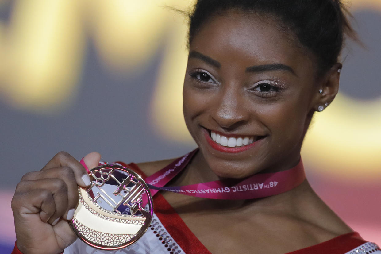 Simone Biles won her first gold in vault at the world competition and broke an all-time record. (AP)