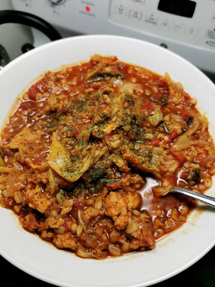 a cabbage stew topped with herbs