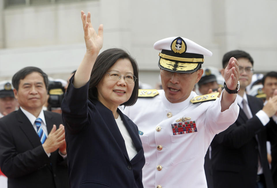 Taiwan's President Tsai Ing-wen, left, waves to Taiwan navy sailors during a groundbreaking ceremony for the island's naval submarine factory in Kaohsiung, southern Taiwan, Thursday, May 9, 2019. (AP Photo/Chiang Ying-ying)