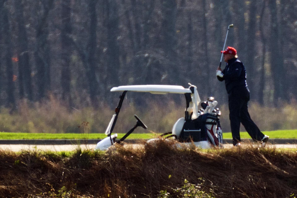 President Donald Trump plays golf at Trump National Golf Club in Sterling, Va., as seen from the other side of the Potomac River in Darnestown, Md., Saturday, Nov. 14, 2020. (AP Photo/Manuel Balce Ceneta)