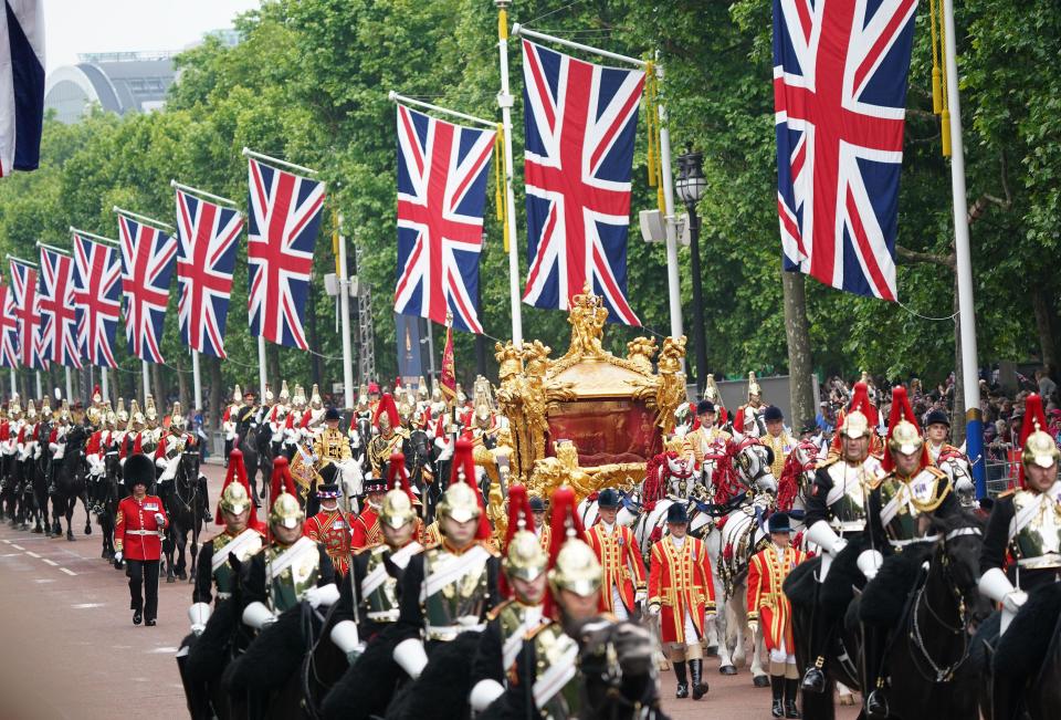 File photo dated 05/06/22 of the Gold State Coach on The Mall during the Platinum Jubilee Pageant in front of Buckingham Palace, London. The coronation of King Charles III is set to cost many millions, and it falls to taxpayers to foot the bill. Issue date: Wednesday April 26, 2023.