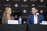 San Francisco Giants catcher Buster Posey looks to his wife, Kristen, during a news conference announcing his retirement from baseball, Thursday, Nov. 4, 2021, in San Francisco. (AP Photo/Tony Avelar)