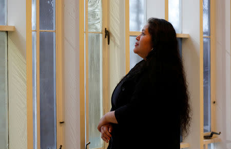 Undocumented Salvadoran immigrant Rosa Gutierrez Lopez looks out a window in the Unitarian Universalist Church where she has been given sanctuary while pressing her case for asylum, in Bethesda, Maryland, U.S., January 2, 2019. REUTERS/Kevin Lamarque