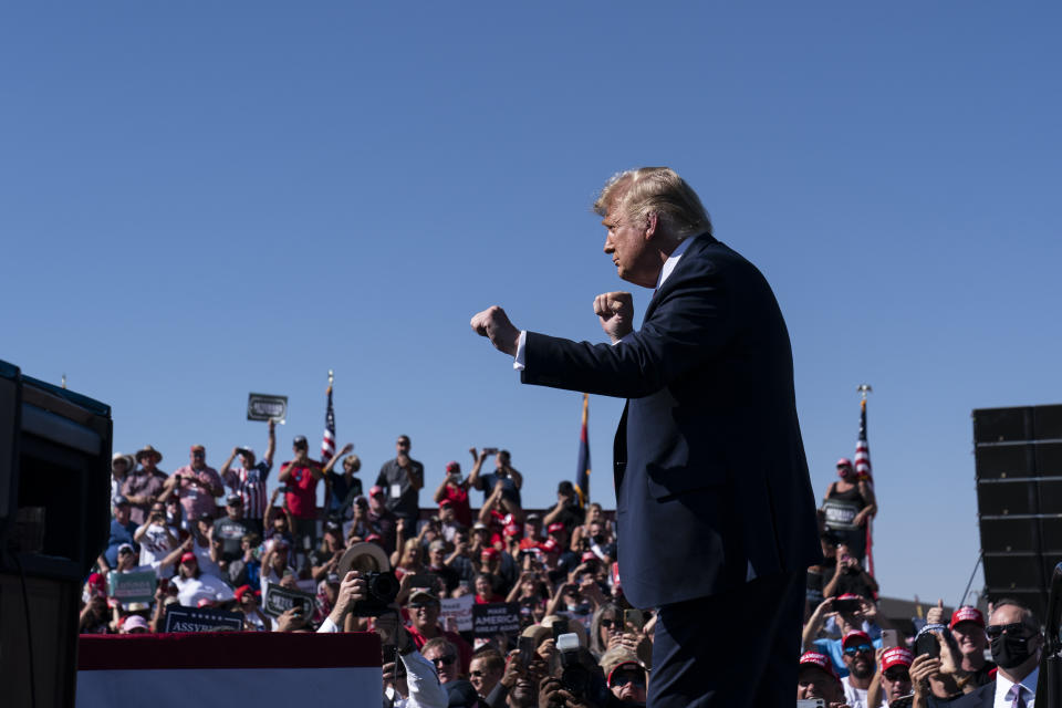 In this Oct. 19, 2020 photo, President Donald Trump dances to "YMCA," after speaking at a campaign rally at Prescott Regional Airport, in Prescott, Ariz. Trump, a man who is famously particular about his appearance, is fully embracing doing a dad dance to the Village People's “YMCA” as the finale to his rallies in the campaign's closing stretch. (AP Photo/Alex Brandon)