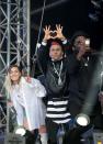 <p>The Black Eyed Peas and Miley Cyrus share a moment on stage in Manchester. (Getty) </p>