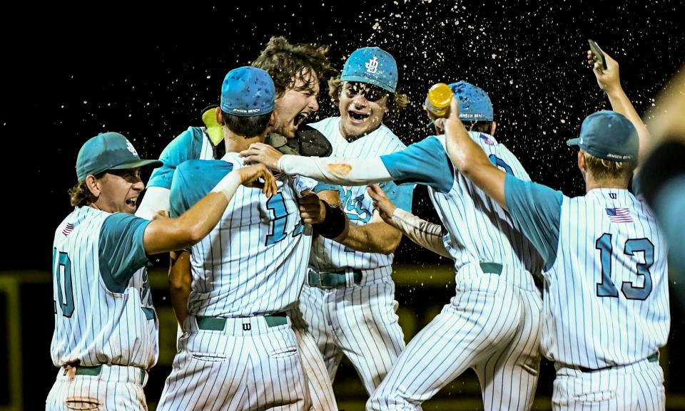 Jensen Beach players celebrate their victory over Merritt Island in the finals of the District 11-5A baseball tournament. Craig Bailey/FLORIDA TODAY via USA TODAY NETWORK