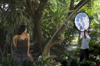 A model poses during a photo shoot for the Lotus Make-up India Fashion Week, at the farmhouse of a designer in New Delhi, India, Friday, Oct. 2, 2020. Unlike a fashion show, models aren't swaying live on a ramp. They are depending on digital technology to rescue their annual extravaganza from the coronavirus pandemic with ''Phygital edition." India’s first digital fashion week is being held from Oct. 14-18, live streaming the spring-summer collections by more than 40 fashion designers. (AP Photo/Manish Swarup)