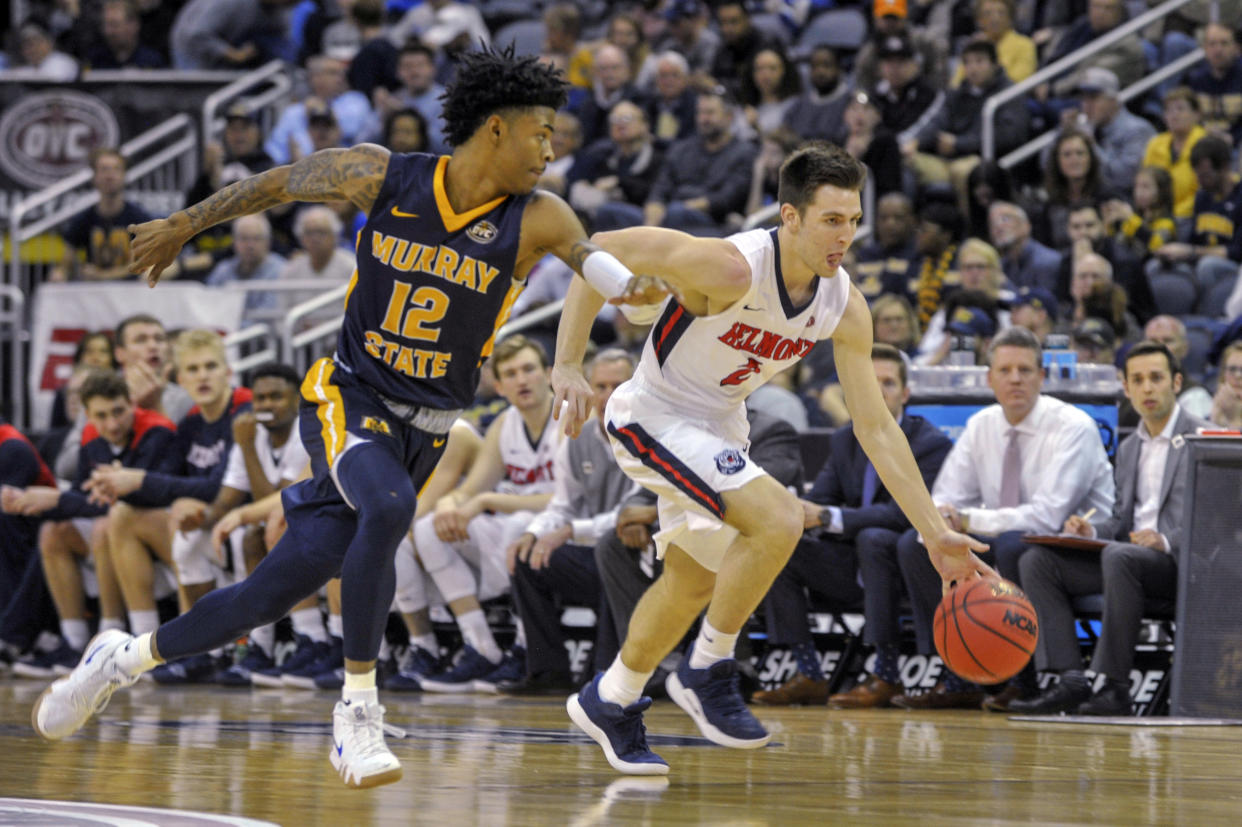 Murray State's Ja Monrant (12) guards Belmont's Grayson Murphy (2) as he drive the ball down the court during the first half of an NCAA college basketball game in the championship of the Ohio Valley Conference basketball tournament, Saturday, March 9, 2019, in Evansville, Ind. (AP Photo/Daniel R. Patmore)