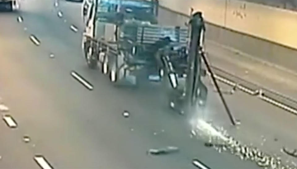 The arm scrapes along the road after smashing into the ceiling. Source: 7 News