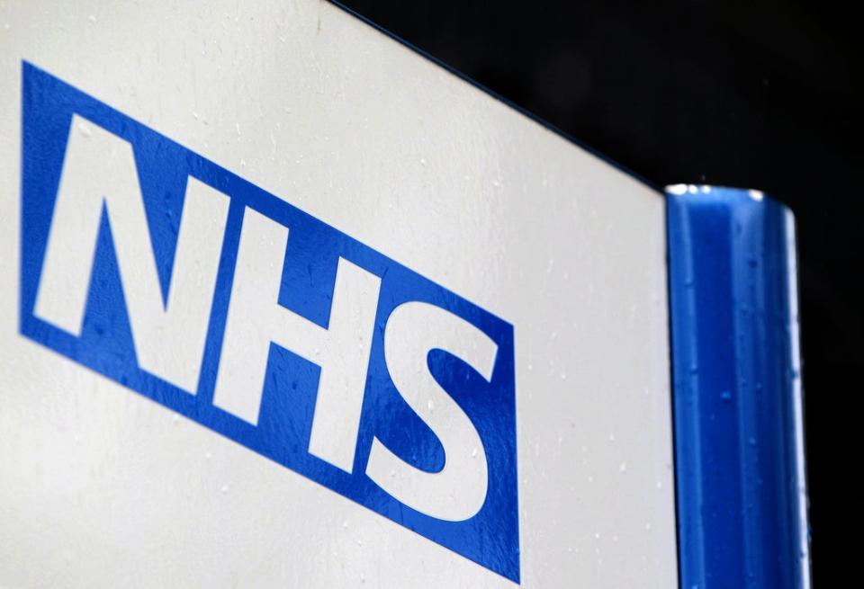 An NHS sign (Yui Mok/PA) (PA Archive)