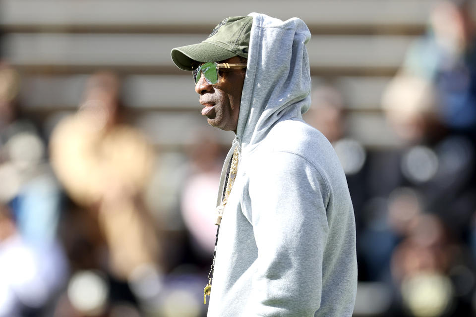 BOULDER, COLORADO - NOVEMBER 11: Head coach Deion Sanders of the Colorado Buffaloes watches as his team warms-up in pregame prior to playing the Arizona Wildcats at Folsom Field on November 11, 2023 in Boulder, Colorado. (Photo by Matthew Stockman/Getty Images)