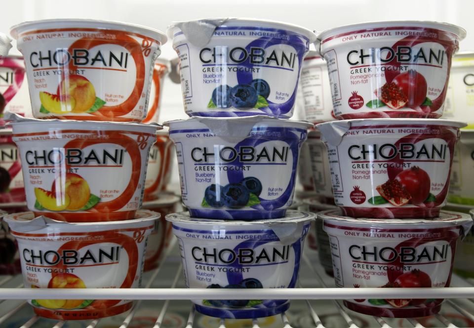 FILE - This Jan. 13, 2012 file photo shows cups of Chobani Yogurt at Chobani Greek Yogurt in South Edmeston, N.Y. Team USA sponsor Chobani, which is based in upstate New York, says it has 5,000 cups of Greek yogurt sitting in a refrigerated warehouse waiting to be flown to the Olympic village. But Russian authorities say the U.S. Department of Agriculture has refused to provide a certificate that is required for dairy products under its customs rules. A U.S. Department of Agriculture spokeswoman says the agency is working with its Russian counterpart to reach a solution to allow the Chobani shipment to go through despite the lack of agreement on general trade requirements for dairy products.(AP Photo/Mike Groll, File)