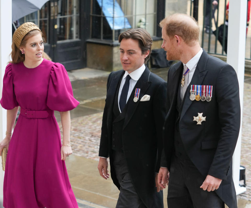 Prince Harry arrived with Princess Beatrice and Edoardo Mapelli Mozzi, and appeared to be in good spirits. (Getty Images)