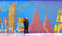 China now has two spectacular great walls. Josh Chalmon stands in front of a giant mosaic made from 85,794 Rubik's Cubes, Macau, China. The wall is 220ft long and 13ft tall and shows the skyline of Macau. Canadian Josh Chalmon had to hand twist all of the Rubik's Cubes before assembling the wall - which is now in the Guinness World Records as the 'Largest Rubik's Cube Mosaic Ever Created' (Solent News/Rex Features)