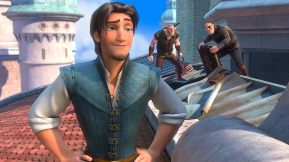 Flynn Rider stands handsomely atop a castle in Tangled