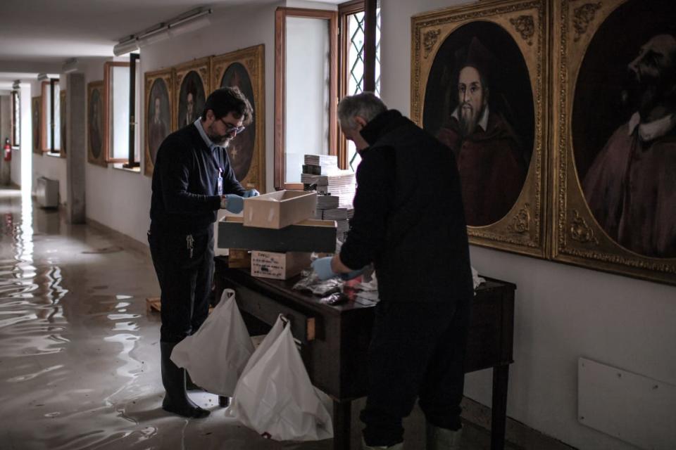 <div class="inline-image__caption"><p>Church workers assess the damage in a flooded wing of St. Mark’s Basilica where religious icons, souvenirs, rosaries, crucifixes and prayer cards are kept. </p></div> <div class="inline-image__credit">Marco Bertorello/AFP/Getty</div>