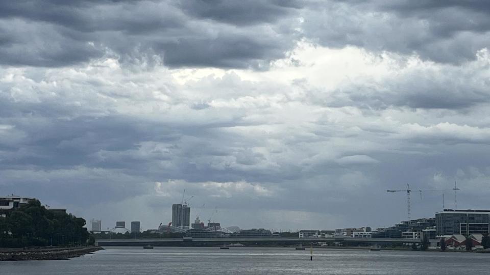 Dark clouds merging over Accor Stadium shortly before Taylor Swift's first concert.