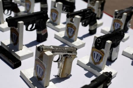 Seized weapons are displayed before being destroyed during an exercise to disable confiscated weapons, in Caracas, Venezuela, August 17, 2016. REUTERS/Marco Bello