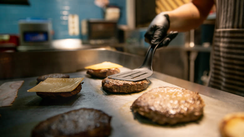 Burgers cooking on flat top