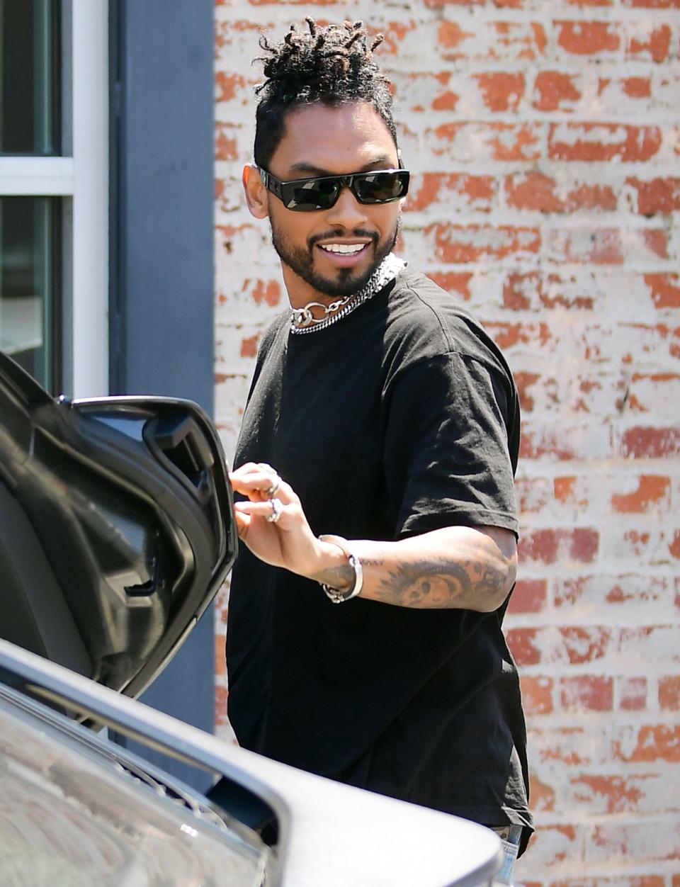 <p>Singer Miguel smiles while shooting a project in L.A. on Monday with Hailey Baldwin. </p>